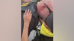 'I promise you. I love you.' An officer and protester connect during demonstration