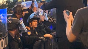 Community leaders react as Phoenix Police officers take a knee with George Floyd protesters