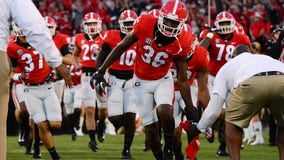 Georgia football players score big coming to rescue of a mother in need