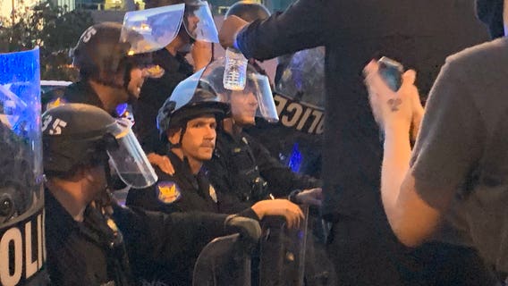 Community leaders react as Phoenix Police officers take a knee with George Floyd protesters