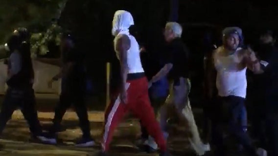 Video shows Gwinnett County sheriff walking with protesters