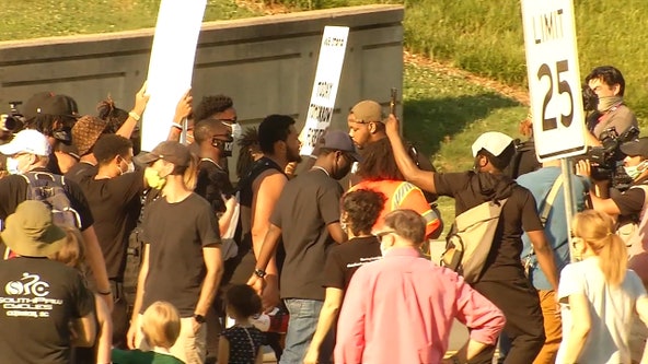 Clemson football players lead march on campus