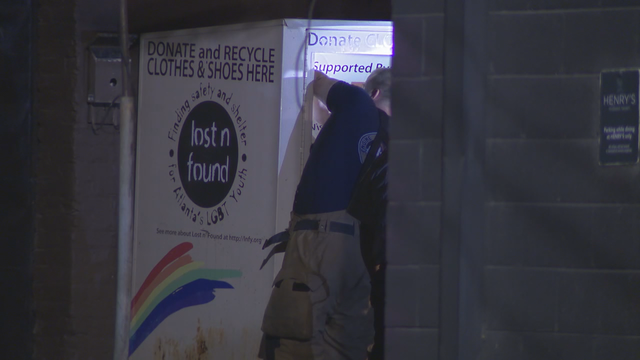 Police: Woman dies after getting trapped in donation box