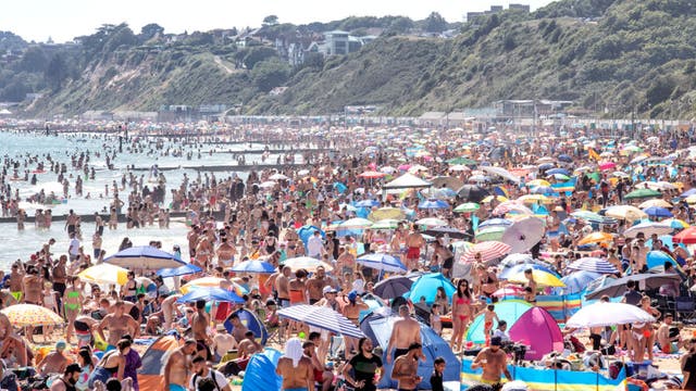 On hottest day of year, thousands cram onto English beaches