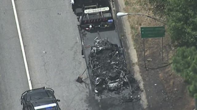 Firefighters work fast to contain blaze sparked by car fire along I-75