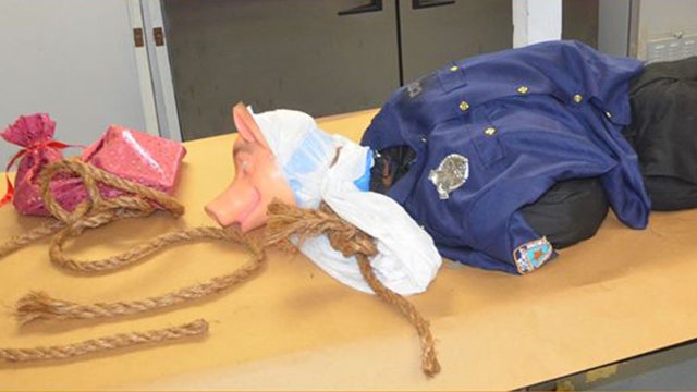 Mannequin wearing pig mask, police uniform discovered hanging from Florida interstate