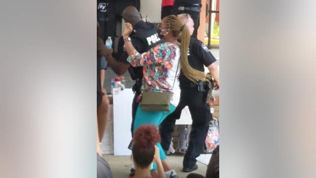 Carrollton police officers dance to 'Cupid Shuffle' with protesters