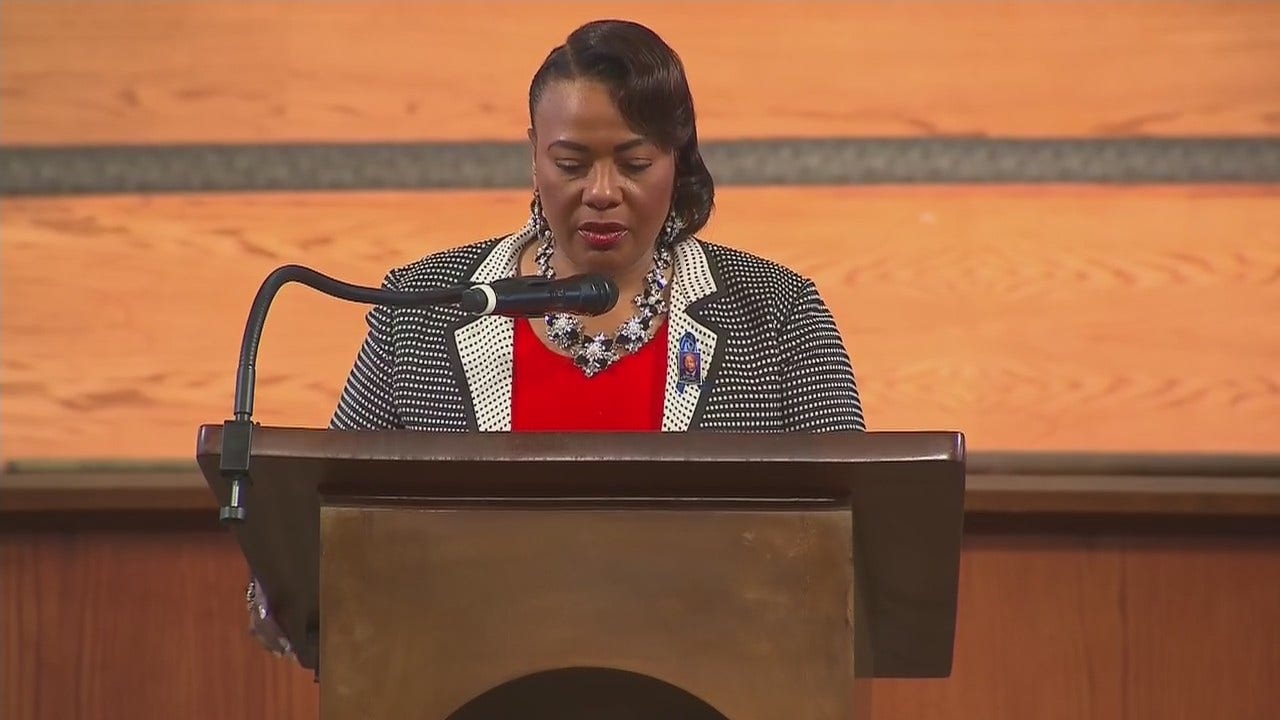 Rev. Dr. Bernice King offers prayer during service for Rep. John Lewis