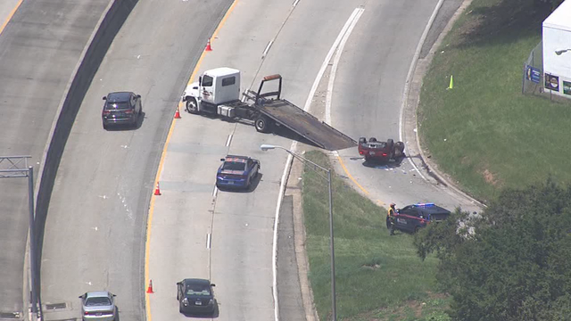 Police: 2 found shot inside overturned Jaguar along busy southwest Atlanta highway