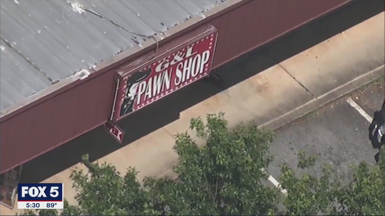 Pawn shop owner opens fire on armed robber