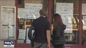 Shuttered North Beach restaurant plasters polarizing messages in its windows