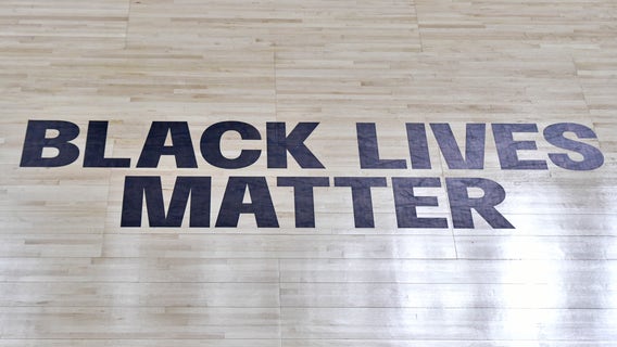 WNBA players wear 'Vote Warnock' T-shirts