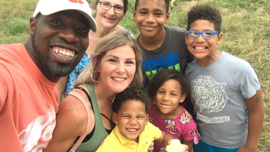 Family smiles for a selfie