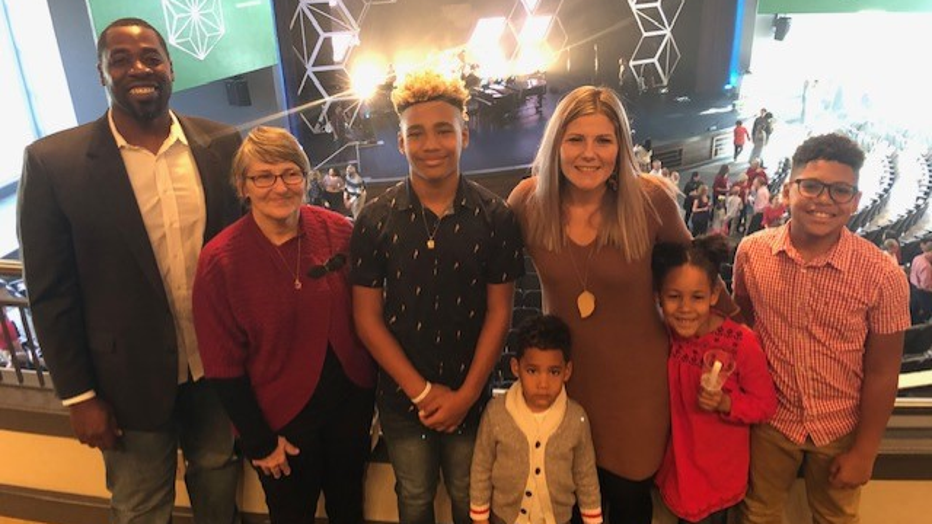 Seven family members pose for a photo after church.