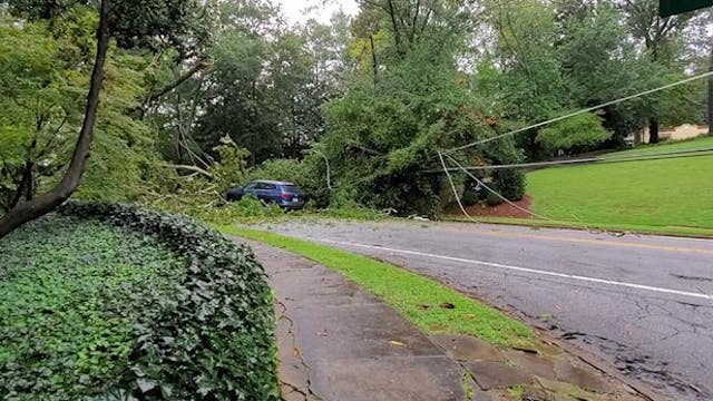 Downed trees, flooded road in Buckhead after storm reaches Georgia