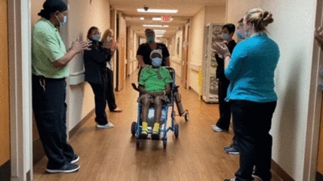 Staff cheer as 102-year-old COVID-19 survivor leaves hospital