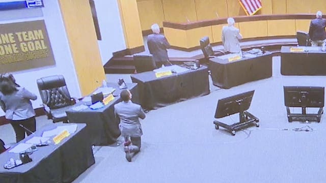 Cobb County School Board member takes a knee during Pledge