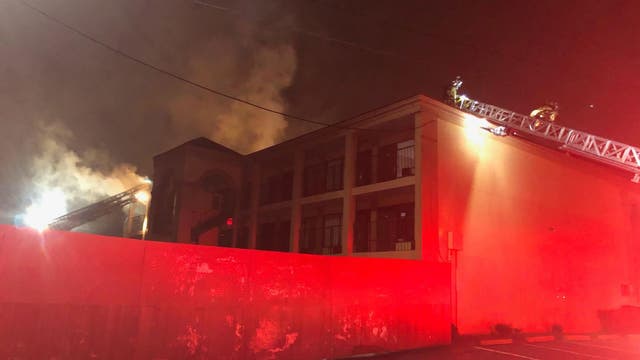 Firefighter rescued while battling DeKalb County hotel blaze