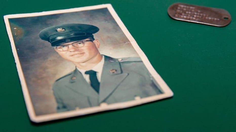 A photo of Ron Hepper and his military ID tag. North Dakota Gov. Doug Burgum presented his widow with the tags Wednesday at the Capitol in Bismarck. Hepper was injured in 1969 by a grenade blast in Vietnam when he lost his boots, where he placed the tags inside. (Office of Gov. Doug Burgum)