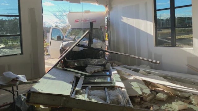 Truck crashes into Suwanee shopping complex