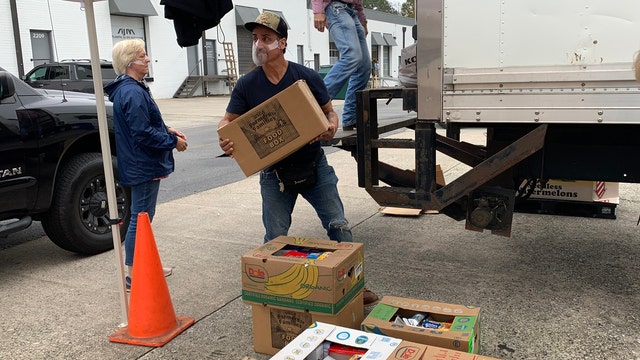 Organizers encouraging people to sign up for entertainment industry food giveaway