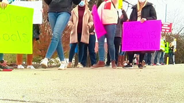 Parents hold rally demanding in-person learning option