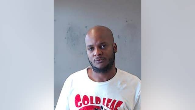 Man arrested for murder after woman found shot in trunk of burned car