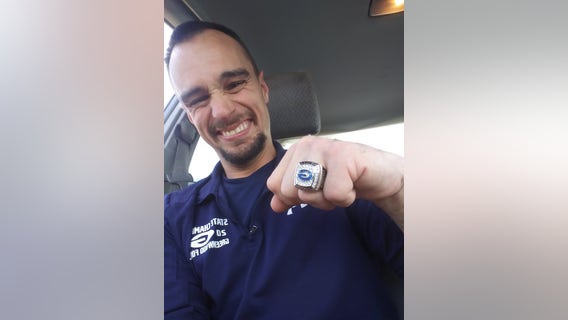 High school football team awards disabled janitor with championship ring