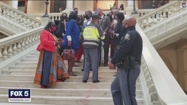 State lawmaker, state police clash during voting bill protest