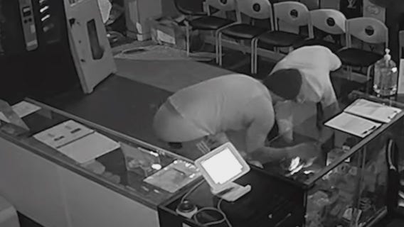 Video captures 2 burglars breaking into Atlanta cell phone shop