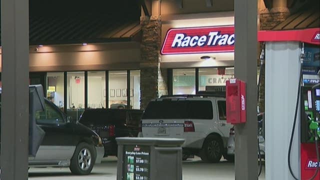 Man killed after car crashes into gas station following shooting, 8-year-old injured