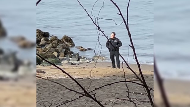 2 Vancouver police officers caught on video posing next to dead body, taking photos