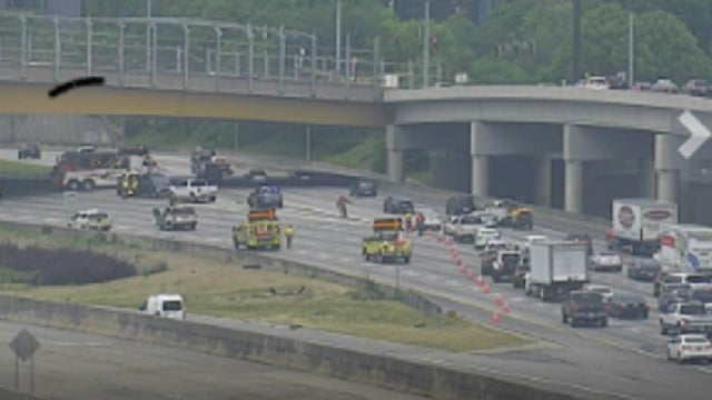 Camper trailer, SUV overturn, driver charged in Downtown Connector crash
