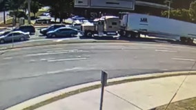 Truck driver charged after pushing car into an intersection