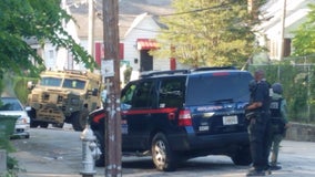 SWAT team called after officers serving a warrant hear gunshots, police say