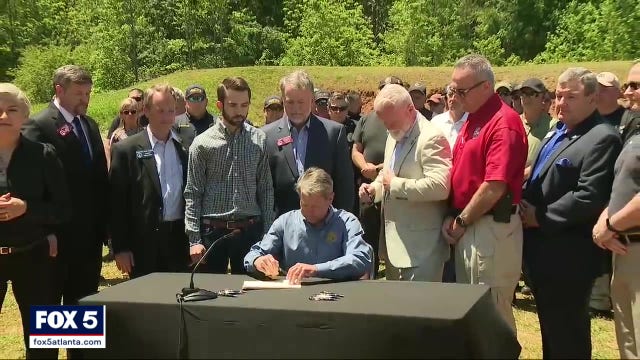 Gov. Kemps signs bill banning 'defunding' local police