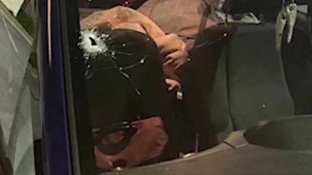 Bullet flies through windshield on busy interstate, nearly hits driver