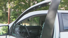 Woman says HERO worker threw flare at her truck and smashed her window