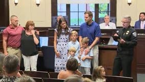 Alpharetta homeowner, Marine honored for saving boys from dog attack