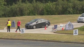 DeKalb residents get COVID-19 vaccines, care packages at drive-thru event