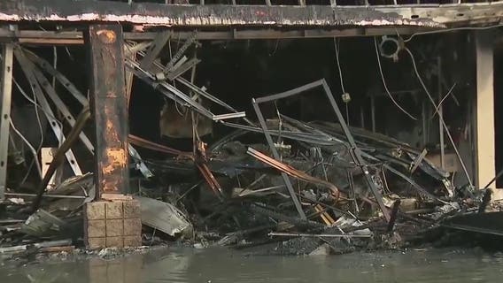 Car chase comes to an end when suspect’s car flies through shopping plaza, catching the building on fire