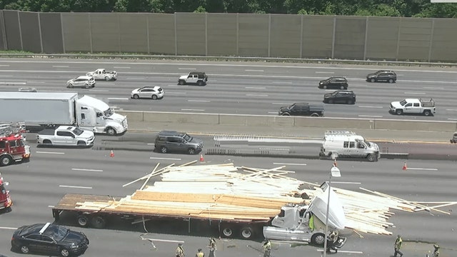 Semi hauling lumber overturns on I-75 causing delays