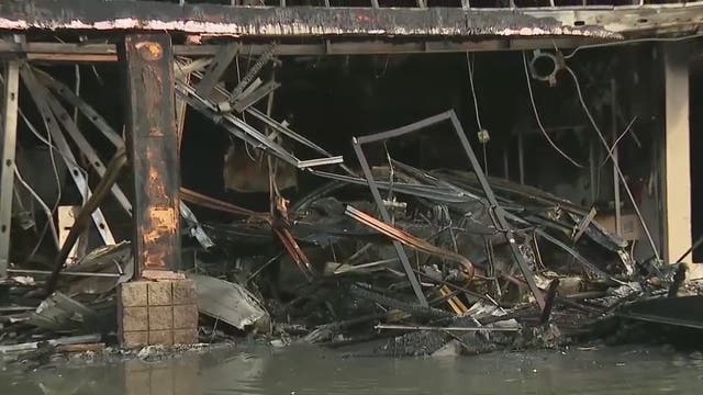 Car chase comes to an end when suspect’s car flies through shopping plaza, catching the building on fire