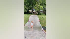 Dad with lightning-fast reflexes catches toddler on slip ‘n slide