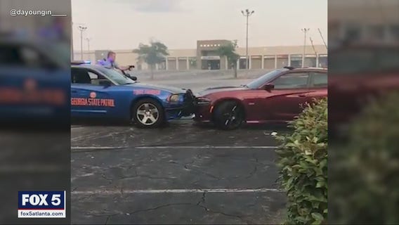 Caught on camera: Driver doing donuts in mall parking lot rammed by state trooper in dramatic pursuit