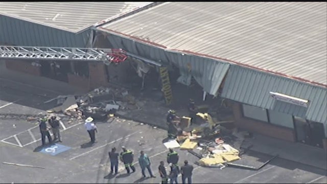 Driver crashes dump truck into Fayetteville antique store