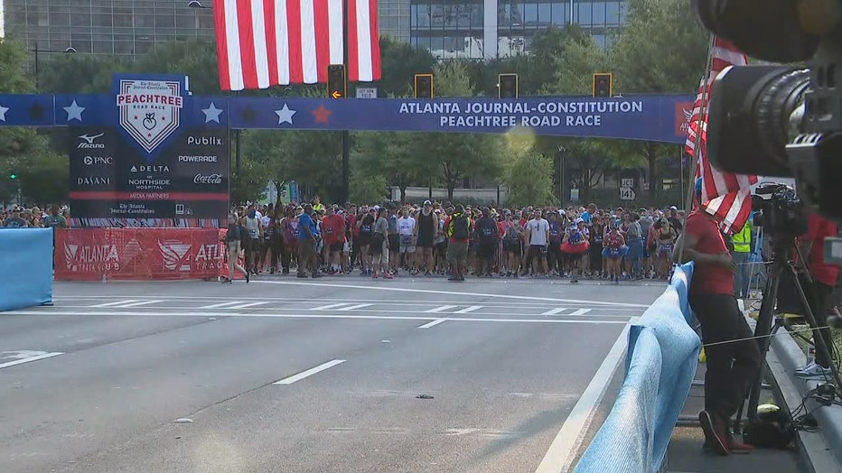 First runners cross finish line on Day 1 of AJC Peachtree Road Race