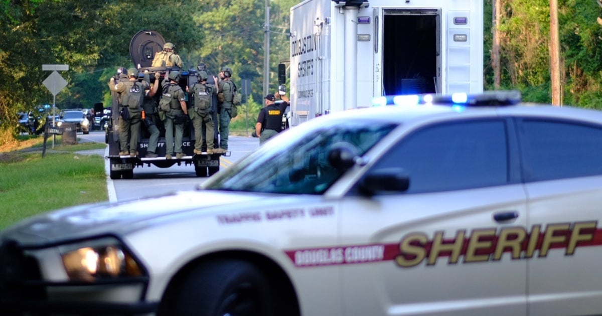Man in custody, woman on the run after standoff at Douglas County home ...