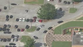 Two men in custody after officer-involved shooting at Lithonia High School