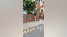 Children recreate Olympic torch relay in UK streets